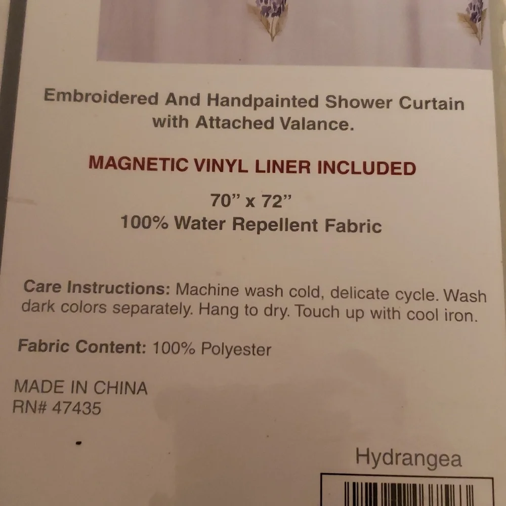 Shower curtain with magnetic liner
